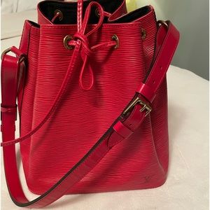 Authentic Louis Vuitton Petit Noe Red Epi leather in good condition.